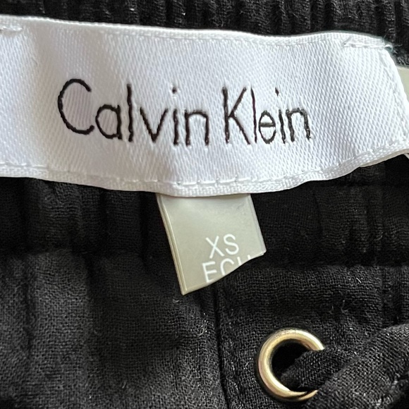 Calvin Klein Off the Shoulder Black and Gold Blouse with Lace Up Detail - Picture 8 of 16